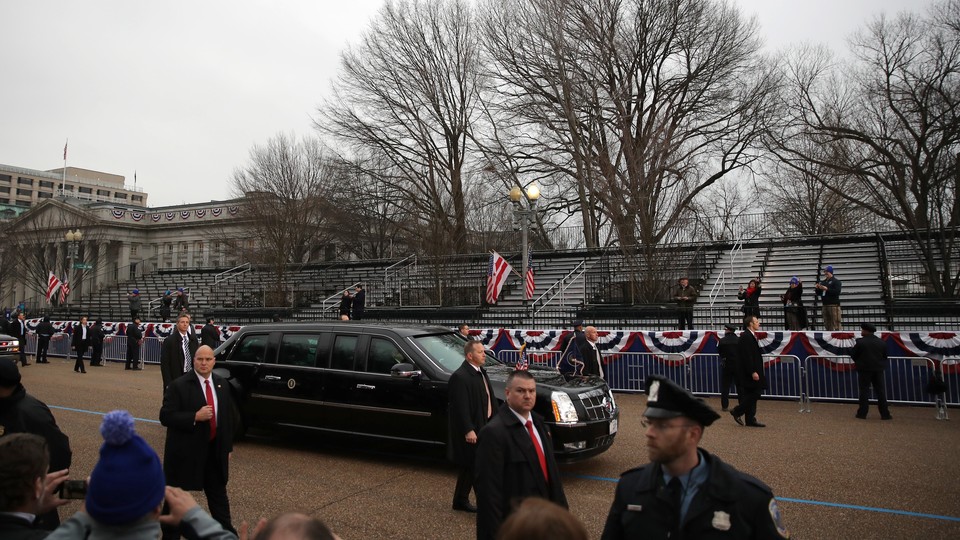 President Trump's limousine passes an empty reviewing stand during the inaugural parade.