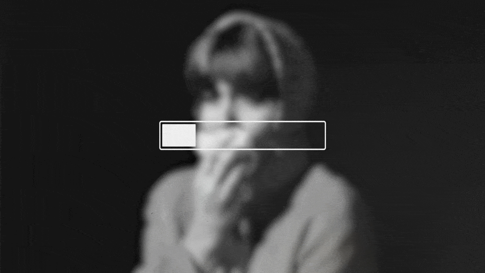 A gif of a loading bar overlaying a phot of a woman holding a handkerchief to her mouth. As the loading bar depletes, the photo blurs.