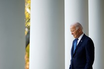 Biden walking through white columns