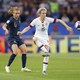 United States forward Megan Rapinoe (15) controls the ball ahead of France defender Marion Torrent (4) in the first half of a quarterfinal match in the FIFA Women's World Cup France 2019