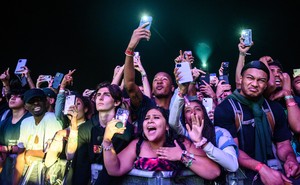 Attendees watch as Travis Scott performs at Astroworld Festival