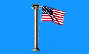 An American flag hanging from a Greek column