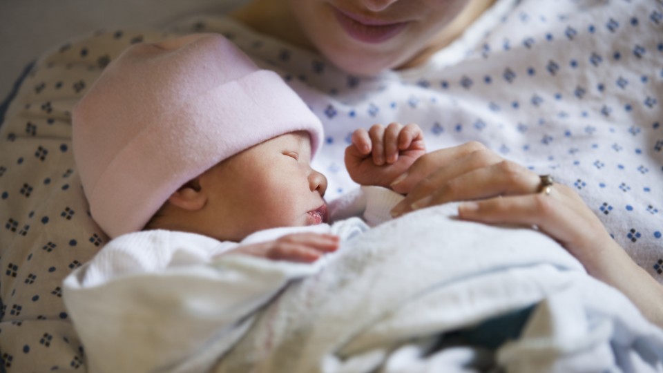 Mother holding newborn