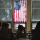 Picture of a classroom with an American flag in the background