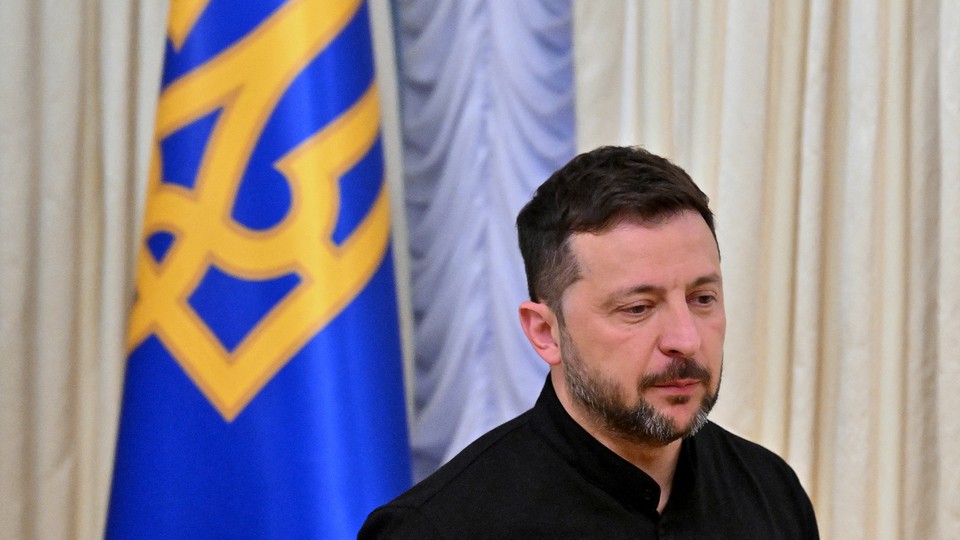 A picture of Volodymyr Zelensky speaking to the media during a press briefing