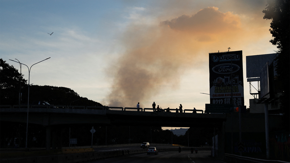 Smoke over the hills of Caracas