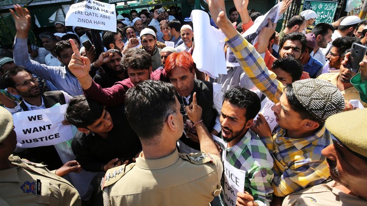 Protesters shouting at policemen