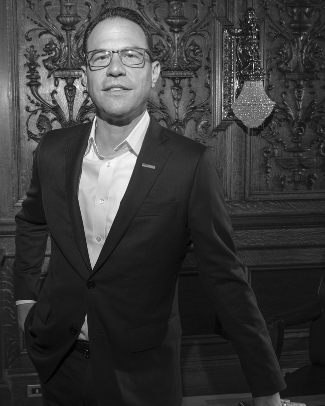 A black and white portrait of Josh Shapiro