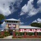 A TGI Fridays restaurant under a cloudy blue sky