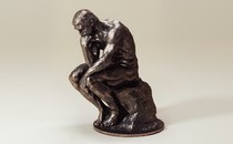 An image of a sculpture of "The Thinker"