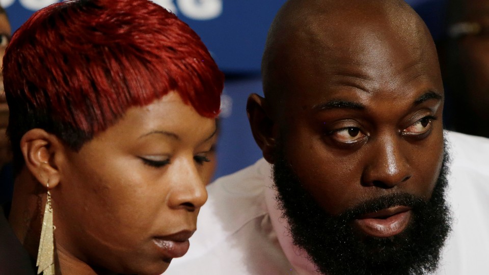 Brown's parents appear at a news conference at the National Press Club in Washington on September 25, 2014.