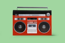 A boom box's parts superimposed on a red book cover.