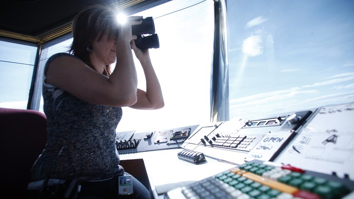 An Air Traffic Control specialist watches plane traffic from the control tower at the Ogden-Hinckley Airport in Ogden, Utah