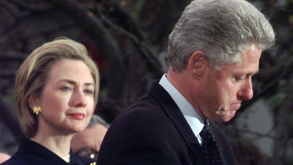 First Lady Hillary Clinton watches President Clinton pause as he thanks those Democratic members of the House of Representatives who voted against impeachment.