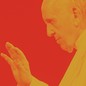 Pope Francis set against a red background