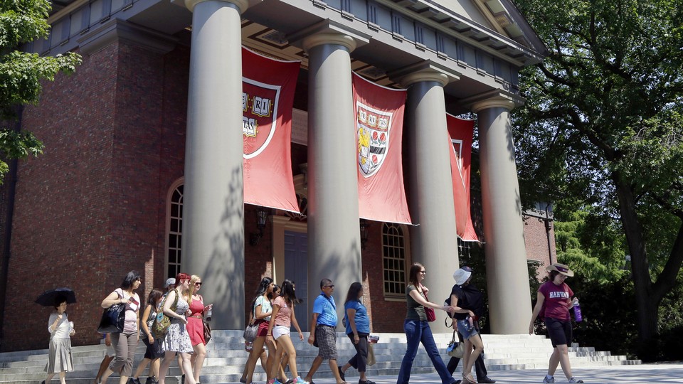 A campus tour walks through the Harvard campus. 