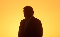 A photo of Trump's silhouette against a yellow background