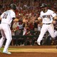 The Arizona Diamondbacks second baseman Daniel Descalso celebrates with the third baseman Jake Lamb after scoring runs in the 2017 National League wildcard playoff baseball game against the Colorado Rockies at Chase Field. 