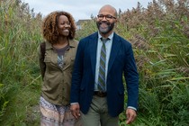 Screengrab from "American Fiction," showing a black couple walking outdoors