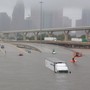 Interstate 45 submerged in Houston with parked cars and trucks