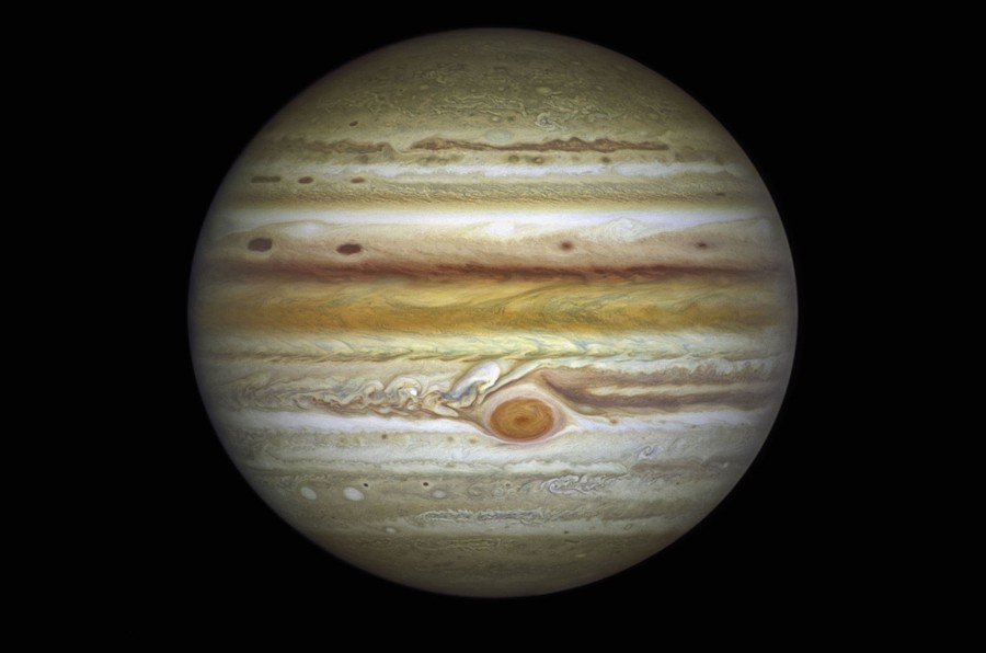A view of the planet Jupiter, showing the many swirls and stripes of its varied atmosphere.