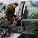 An aide carries the nuclear football onto Marine One