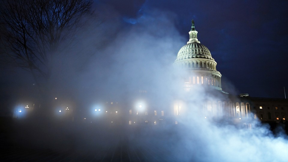 Photo of the U.S. Capitol on a foggy night