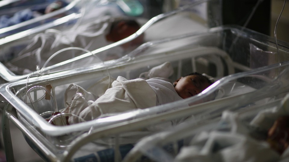 Newborn babies sleep in cribs inside a hospital in the Philippines, in 2013, five days after Typhoon Haiyan devastated the area. 