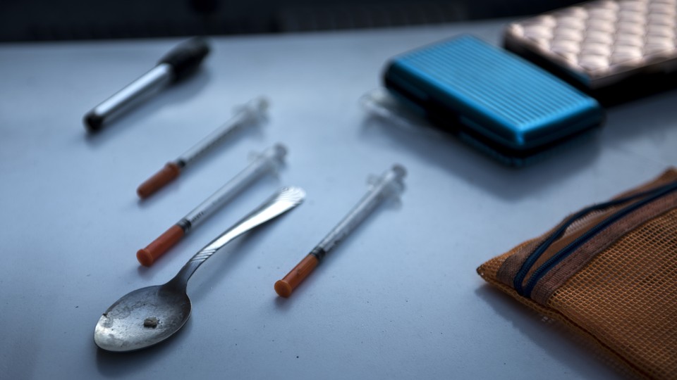 Drug paraphernalia, including a spoon and syringes