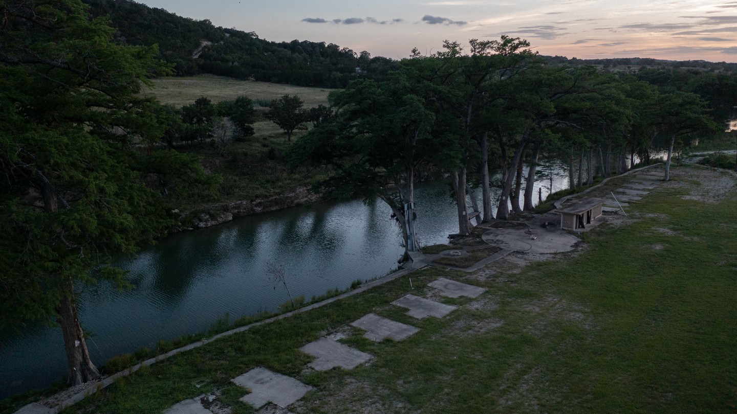 Empty concrete RV pads along a riverbank in Texas.