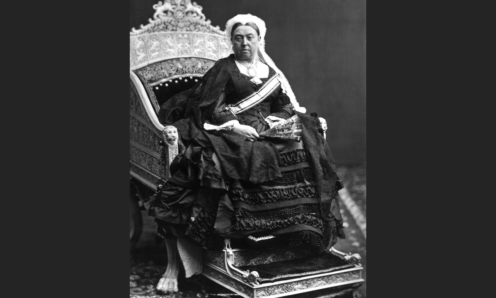 Queen Victoria, seated on a carved ivory throne