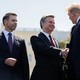 Christopher Wray shakes Donald Trump's hand as Kevin McAleenan looks on.