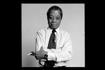 Black-and-white portrait of James Baldwin