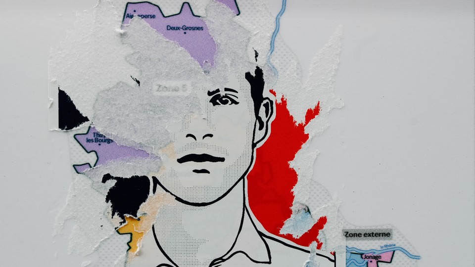 A photo of a half-torn sticker showing a portrait of Quentin Deranque