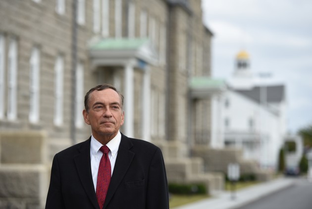A man poses for a portrait.