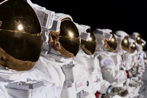 Astronauts standing in an orderly line