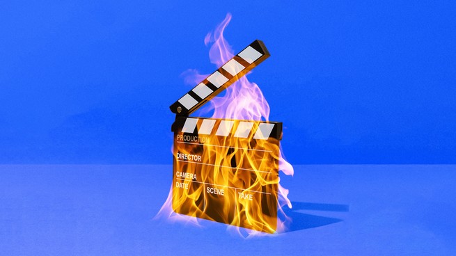 A movie clapperboard on fire