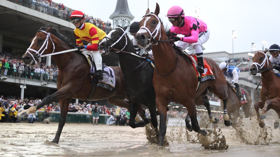 Chris Landeros aboard Bodexpress (left) races Luis Saez aboard Maximum Security (right) during the 145th running of the Kentucky Derby