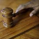 A gavel sits on a desk. 