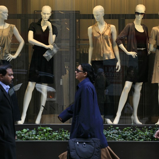 A group of mannequin legs displayed outside a casual clothing shop