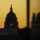 An photograph of the U.S. Capitol against a yellow sky