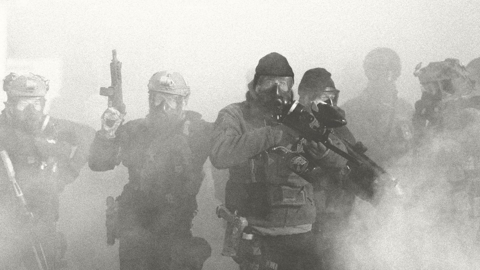 Black-and-white photograph of armed agents wearing gas masks and holding guns walking through a cloud of smoke