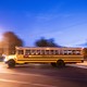 A school bus picks up children in the early morning