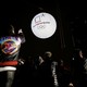 Photographers take photographs of a giant inflatable ball bearing the logo of the 2018 Pyeongchang Winter Olympics.