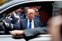 Donald Trump framed by a car window