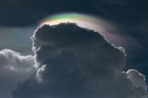 Artistic photo of a cloud in front of the sun