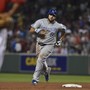 The Kansas City Royals third baseman Mike Moustakas (8) rounds the bases after hitting a three-run home run during the fourth inning against the Boston Red Sox at Fenway Park.