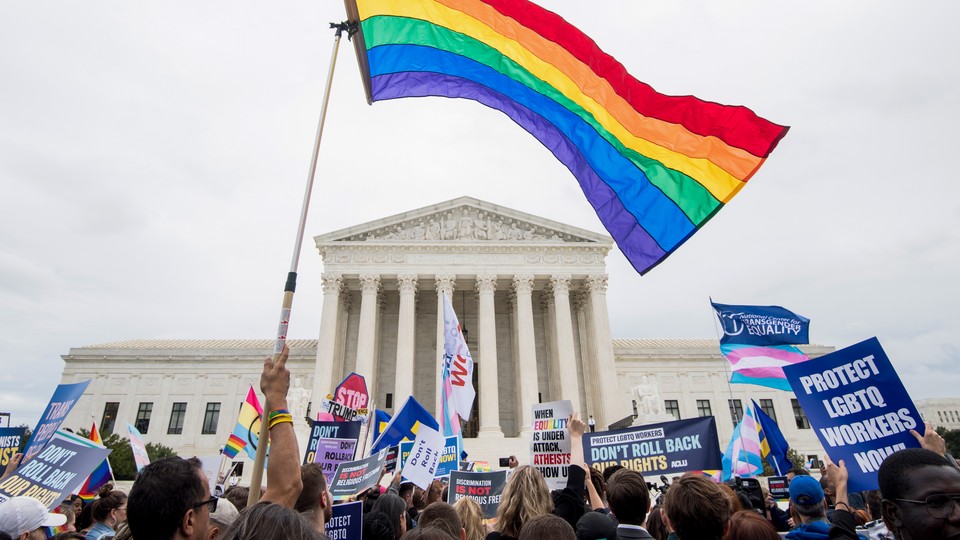 A gay-pride flagging waving in front of the Supreme Court