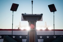 An empty lectern at a Trump rally