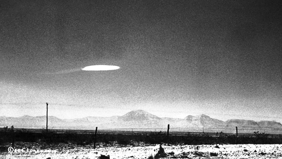 A photo of a UFO-shaped object in the sky